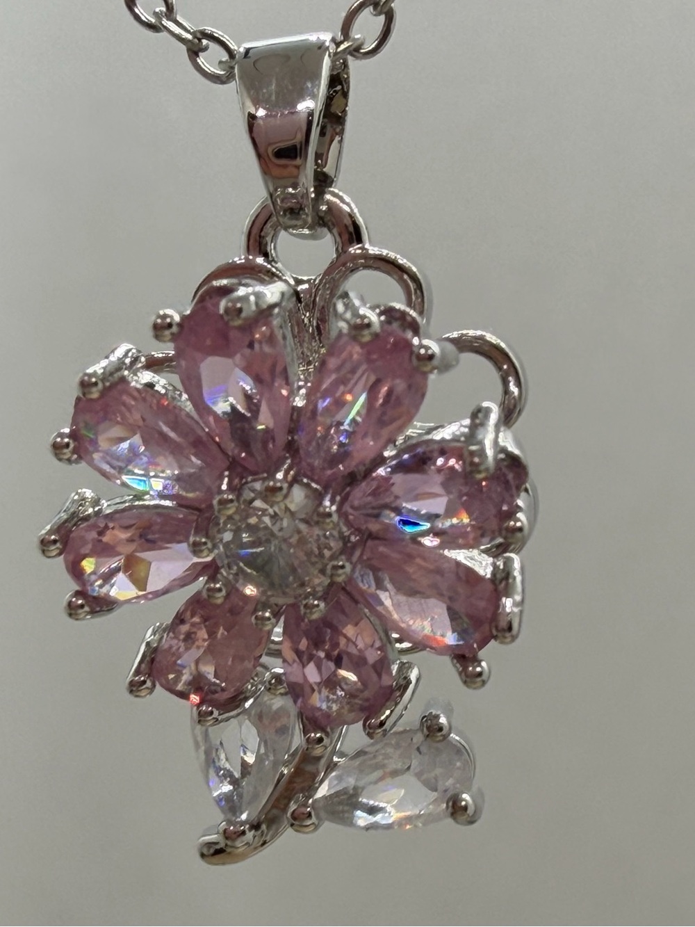 Spinning Silver Floral Pendant Necklace with Pink Crystal Petals